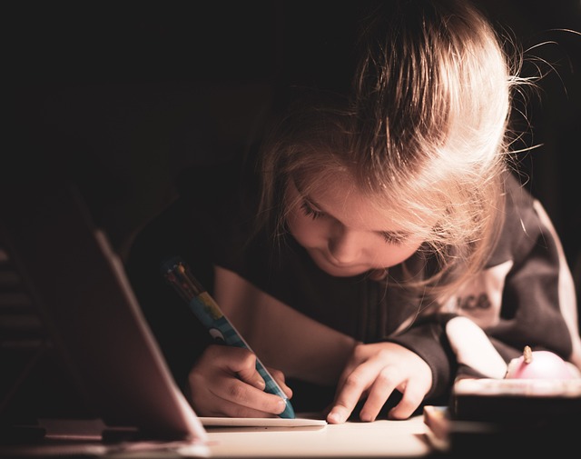 Child doing homework at desk